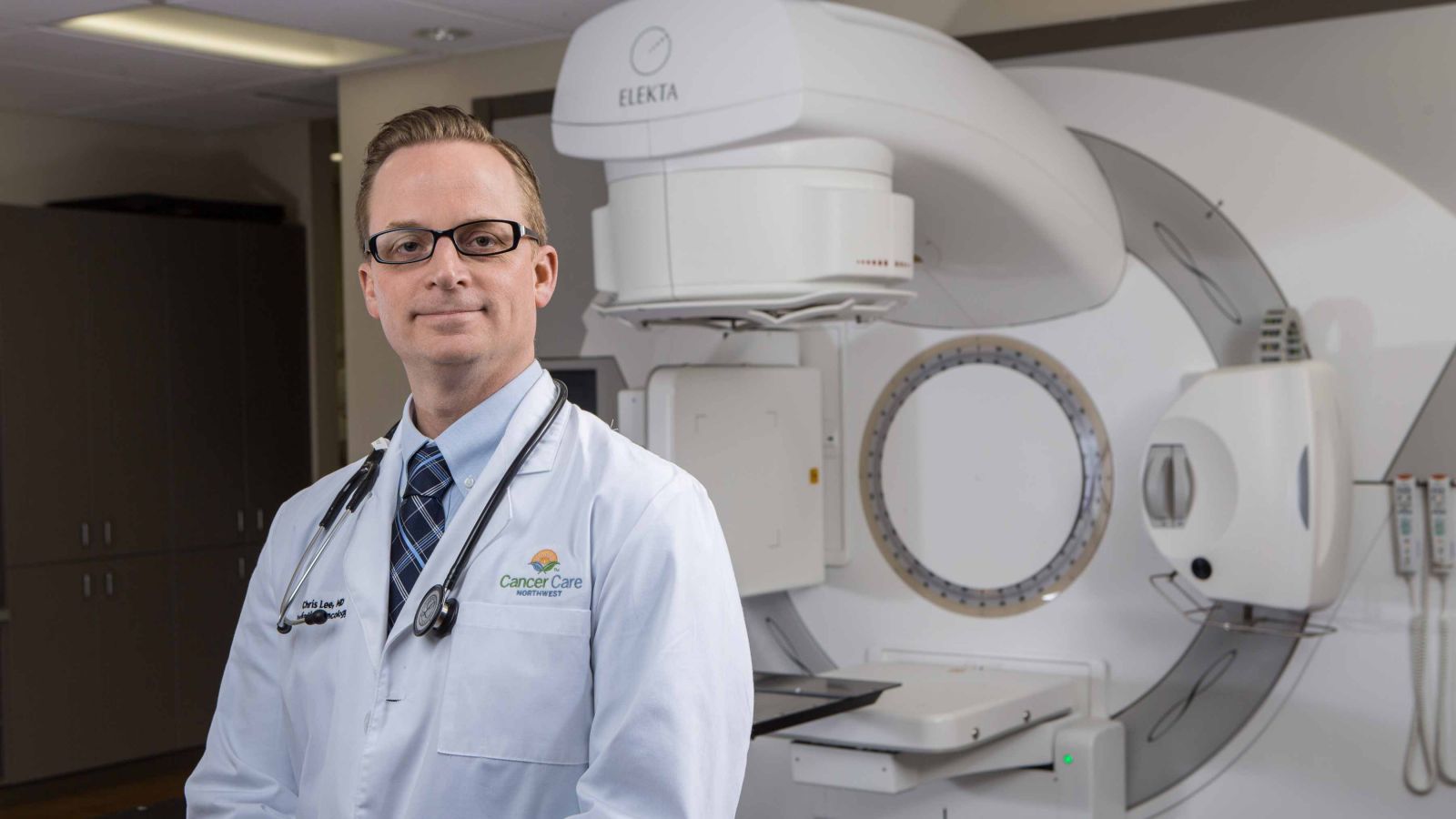 Radiation Oncologist, Dr. Christopher Lee, pictured with the Elekta LINAC, a state-of-the-art, image-guided radiation therapy system